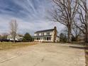 Wide shot of a two-story home with ample parking space on a spacious driveway at 509 Baucom Deese Rd, Monroe, NC 28110