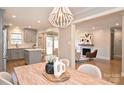 Open concept dining area with kitchen and living room views at 532 Scaleybark Rd, Charlotte, NC 28209