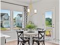 Breakfast nook with a round table and four chairs, near a window at 5514 Galloway Dr # 63P, Stanfield, NC 28163