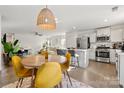 Modern eat-in kitchen with white cabinets and stainless steel appliances at 9706 Hamel St, Charlotte, NC 28215