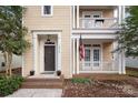 Inviting front entrance with brick steps and a covered porch at 13228 Kennerly Dr, Huntersville, NC 28078