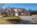 Charming brick home featuring a well-manicured lawn and inviting front entrance at 219 Society Rd, Statesville, NC 28625