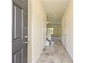 Bright entryway with tile flooring, leading to staircase and living areas at 2226 Catawba Trace Dr, Catawba, NC 28609