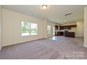 Open living room with carpeted floor and kitchen access at 2226 Catawba Trace Dr, Catawba, NC 28609