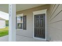 Dark brown front door with sidelights and white trim at 2230 Catawba Trace Dr, Catawba, NC 28609