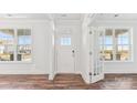 Bright entryway featuring a white front door, sidelight windows, and beautiful hardwood floors at 355 Miramar Dr, York, SC 29745