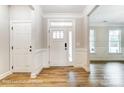 Inviting foyer with stylish wood-look floors and classic trim details at 5108 Verona Rd # 94, Charlotte, NC 28213