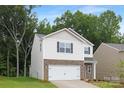Beautiful two-story house with stone accents and a two-car garage at 5219 Reedy Ridge Rd, Charlotte, NC 28215