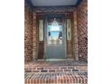 Brick front entryway with a gray front door and sidelights at 1044 Tarlton Dr # 0, Shelby, NC 28052