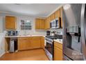 Kitchen with stainless steel appliances and wood cabinets at 2111 Bennett Woods Ct, Charlotte, NC 28216