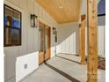 Inviting front porch with wooden ceiling and columns at 2712 Yellow Bell Way, Monroe, NC 28112