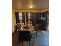 Small dining area with round table and four chairs at 3103 Minnesota Rd, Charlotte, NC 28208