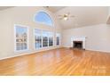 Living room features hardwood floors, fireplace and lake view at 4907 Foxbriar Trl, Charlotte, NC 28269