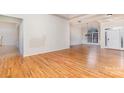 Spacious living room with hardwood floors and large windows at 4907 Foxbriar Trl, Charlotte, NC 28269