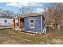 Side view of a charming renovated home with a fenced yard at 503 Birch St, Lowell, NC 28098