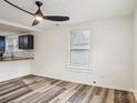 Bright living room with hardwood floors and ceiling fan at 503 Birch St, Lowell, NC 28098