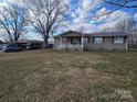 Ranch home with carport, covered porch, and spacious yard at 535 Springs East Rd, Lincolnton, NC 28092