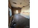 Unfinished bedroom with wood floors and exposed walls at 543 Salisbury St, Wadesboro, NC 28170