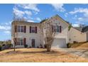 Two-story house with attached garage and manicured lawn at 5767 Dove Point Dr, Concord, NC 28025