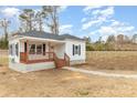 Newly renovated home with a front porch and stone walkway at 6 Walnut St, Great Falls, SC 29055