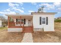 Newly renovated home with a front porch and stone walkway at 6 Walnut St, Great Falls, SC 29055