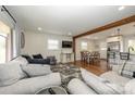 Open concept living room with a view into the kitchen and dining area at 7445 Briardale Dr, Charlotte, NC 28212