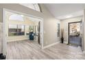 Bright and airy entryway with sunroom and hardwood floors at 874 Ledgestone Ct, Tega Cay, SC 29708