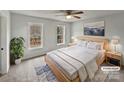 Virtually staged bedroom with light walls and new carpet at 1002 Joanne Ct, Kings Mountain, NC 28086