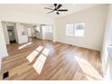 Open concept living room with luxury vinyl floors, a ceiling fan, and plenty of natural light at 1003 W 4Th Ave, Gastonia, NC 28052