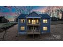 Two-story house with gray siding, deck, and a sloping backyard at 113 Brentwood Dr, Maiden, NC 28650