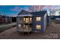 Two-story house with gray siding, deck, and sloping backyard at 113 Brentwood Dr, Maiden, NC 28650