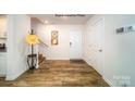 Bright entryway with hardwood floors and coat rack at 12152 Lady Bell Dr, Charlotte, NC 28278