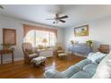 Bright living room with hardwood floors, comfortable seating, and a large window at 1224 Castlegate St, Gastonia, NC 28054