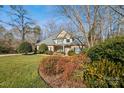 Two-story house with a front yard and landscaping at 12710 Winding Ridge Rd, Huntersville, NC 28078