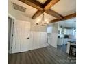 Bright dining room features hardwood floors and a rustic chandelier at 1325 Bostwood Ln, Concord, NC 28025