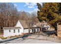 House exterior with large trees and driveway at 1325 Bostwood Ln, Concord, NC 28025