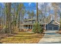 Two-story house with wraparound porch and attached two-car garage at 14264 Maple Hollow Ln, Mint Hill, NC 28227