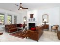 Spacious living room with leather sofas, fireplace, and hardwood floors at 14310 Cameryn Elise Dr, Cornelius, NC 28031