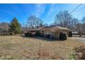 Backyard view of the house showing a large grassy area at 194 Bynum Rd, Lincolnton, NC 28092