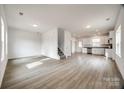 Spacious living room with hardwood floors and kitchen view at 205 Benfield Rd, Kings Mountain, NC 28086