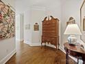 Bright hallway with hardwood floors and antique furniture at 2823 Providence Rd # 252, Charlotte, NC 28211