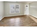 Bright living room with neutral walls and wood-look flooring at 3164 River Rd, Lincolnton, NC 28092