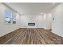 Spacious living room with hardwood floors and a modern fireplace at 319 Bezelle Ave, York, SC 29745