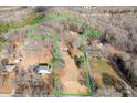 Aerial view showing house location and lot size on a wooded lot at 3515 Back Creek Church Rd, Charlotte, NC 28213