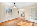 Bright dining room with hardwood floors and view to living room and kitchen at 3515 Back Creek Church Rd, Charlotte, NC 28213