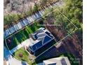 Aerial view showing approximate property lines on a large lot with mature trees surrounding the house at 407 Blue Bay Ct, York, SC 29745