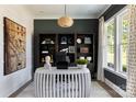 Bright home office features built-in shelving and a white desk at 504 Meadow Ridge Dr, Belmont, NC 28012