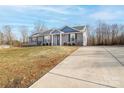 Gray house with a front porch and a large yard at 521 Summer Creek Dr, Stanley, NC 28164