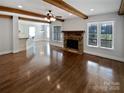 Open living room showcasing hardwood floors and exposed beams at 6000 Bickett Ridge Dr, Monroe, NC 28110