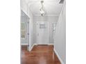 Bright entryway with hardwood floors and a modern light fixture at 6030 Sharon Hills Rd, Charlotte, NC 28210